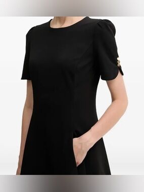 DKNY black fit-and-flare midi dress. New with Tags. Size: 2. Ask: $99.